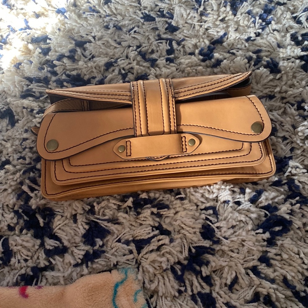 This is a Antonio Melani mini purse. It is like brown with many pockets.
